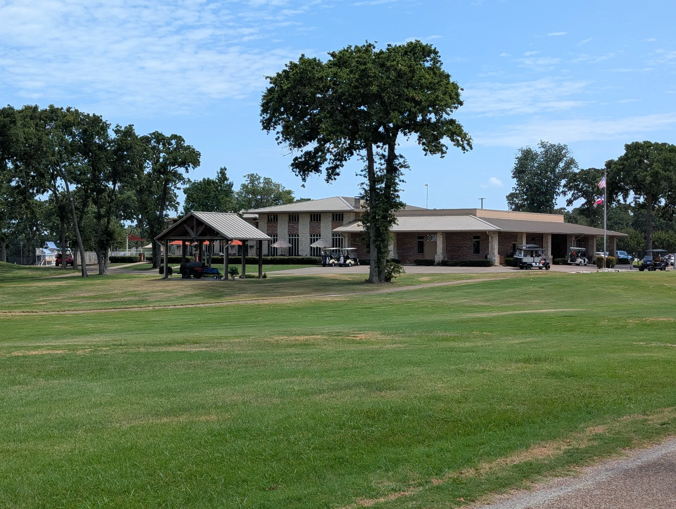 Cedar Creek Country Club clubhouse viewed across the fairway
