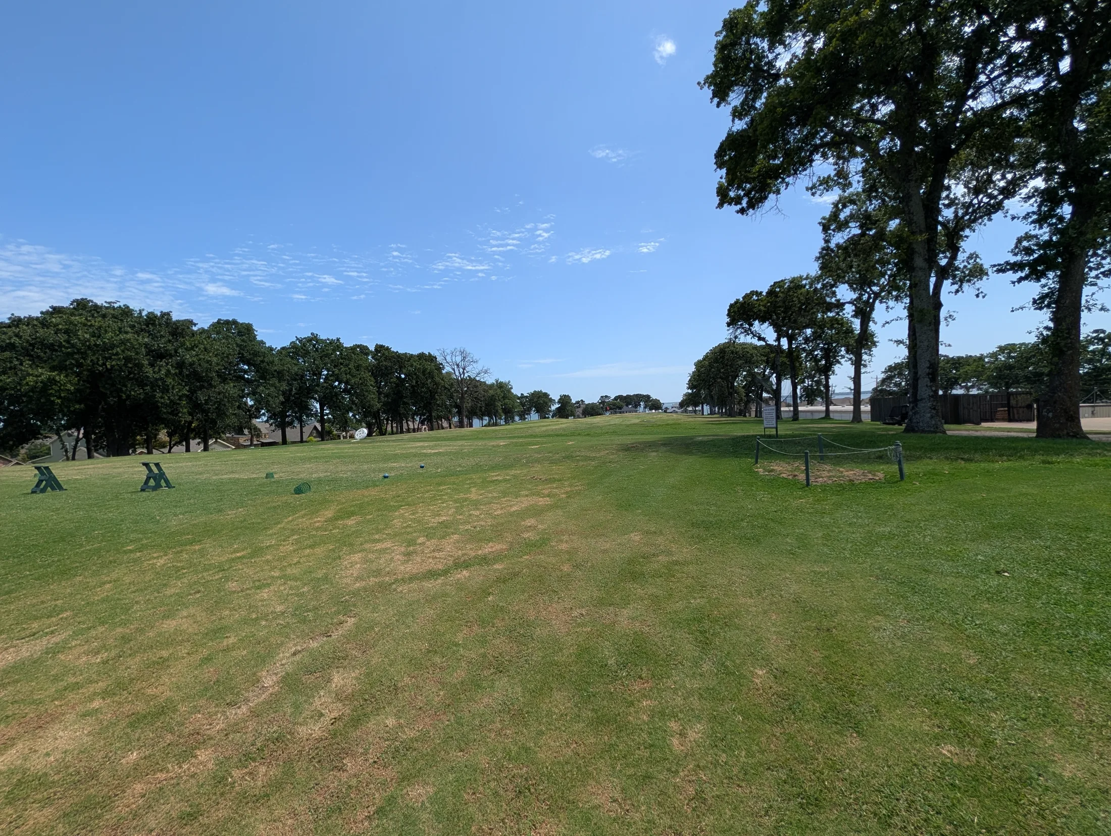 Driving range at Cedar Creek Country Club with the lake beyond