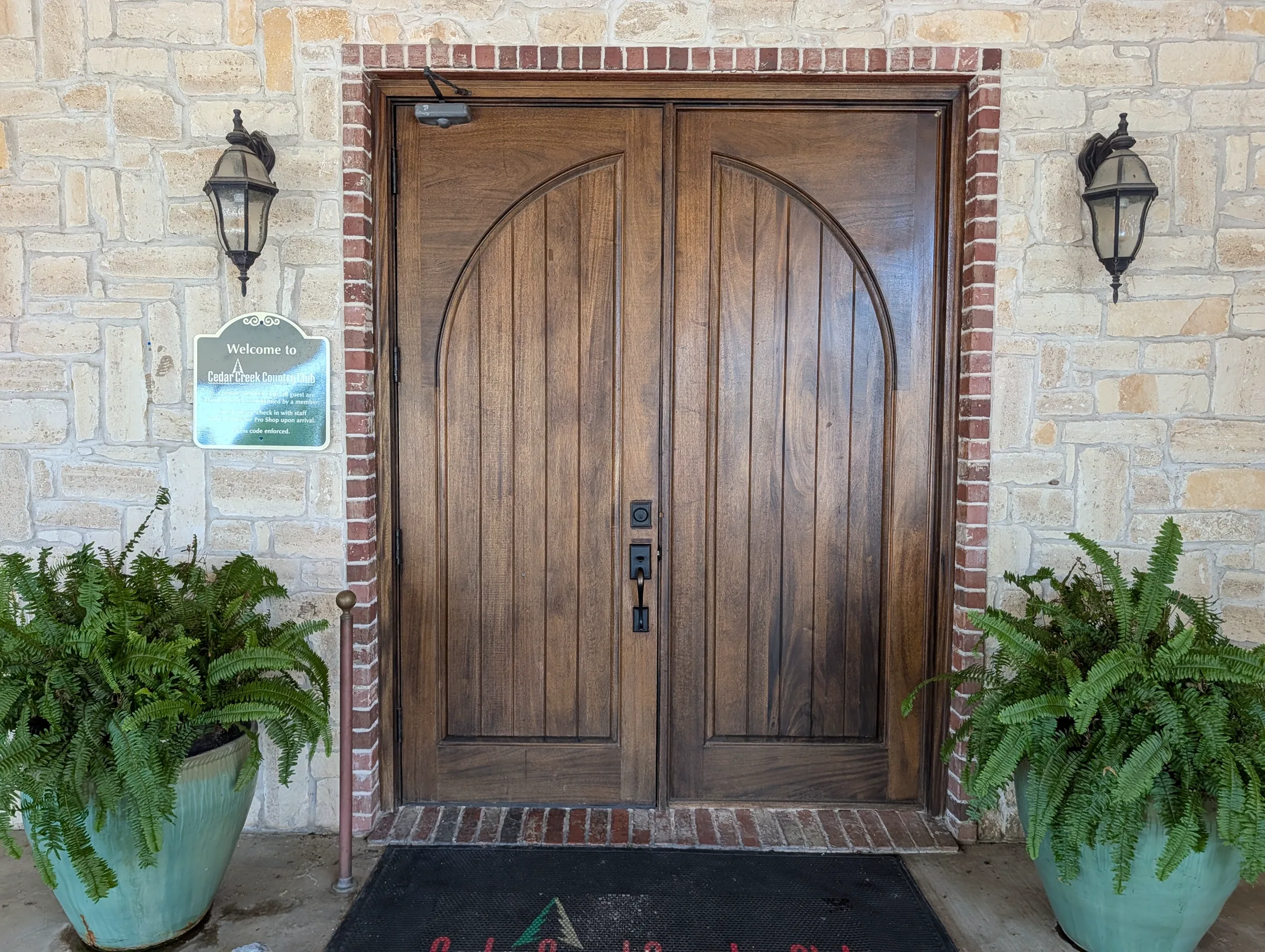 Welcoming front entrance doors at Cedar Creek Country Club