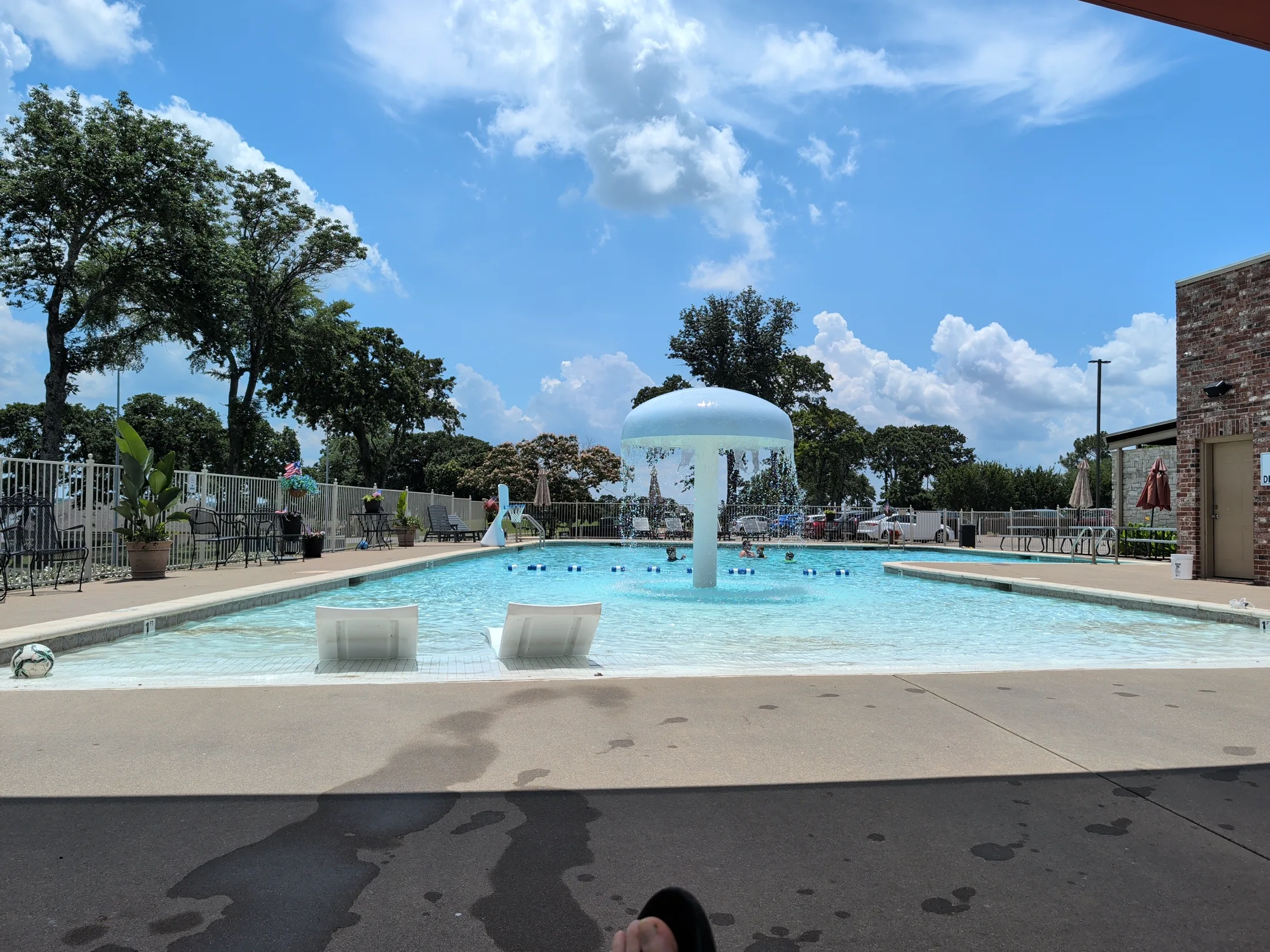 Cedar Creek Country Club swimming pool with a splash fountain